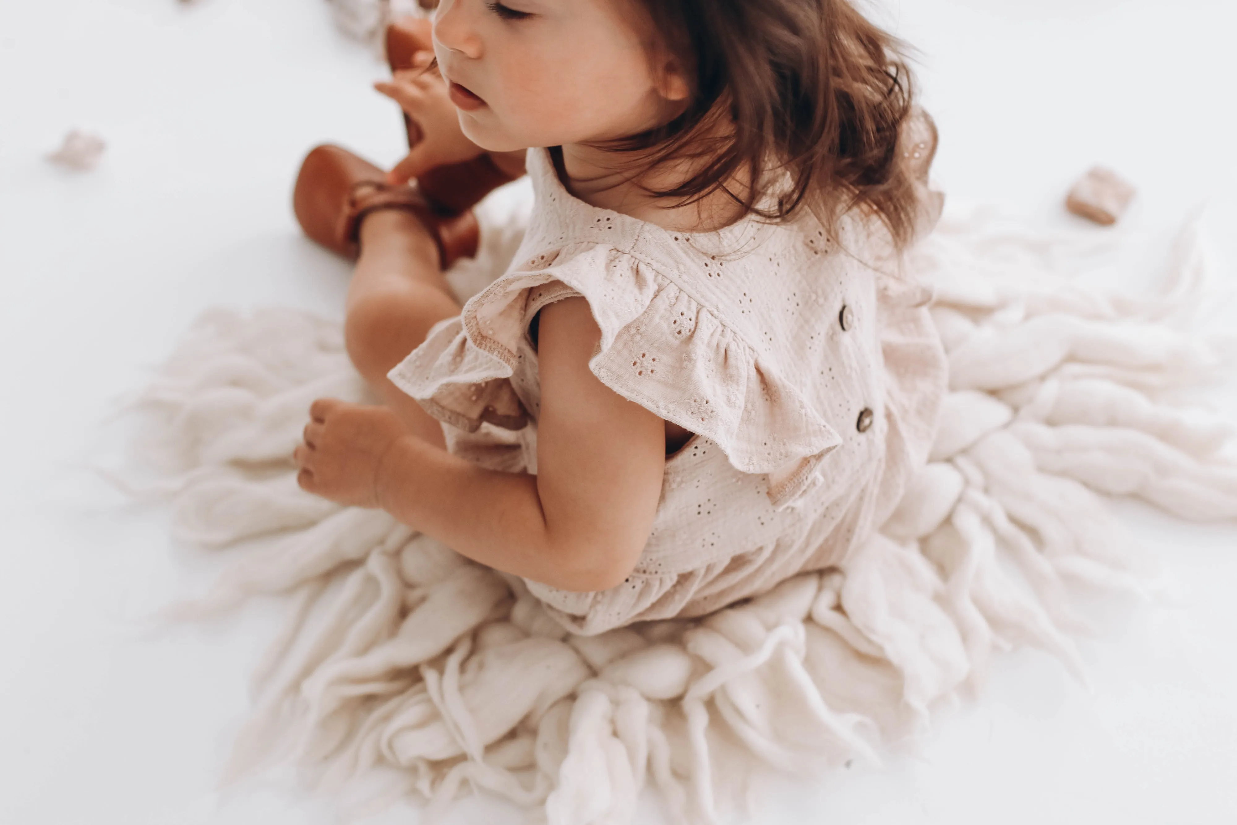 Embroidered muslin romper with frills